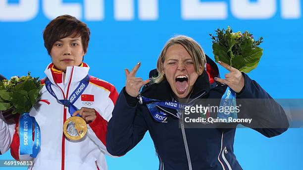 Gold medalist Jianrou Li of China and silver medalist Arianna Fontana of Italy celebrate during the medal ceremony for the Short Track Speed Skating...