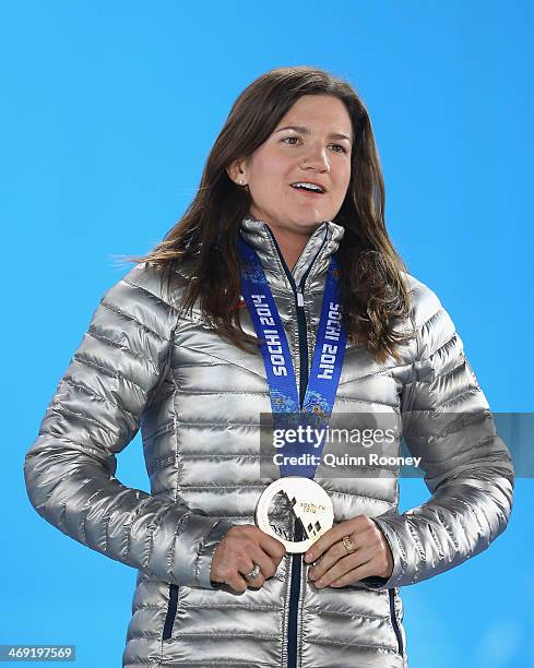 Bronze medalist Kelly Clark celebrates during the medal ceremony for the Snowboard Ladies' Halfpipe on day six of the Sochi 2014 Winter Olympics at...