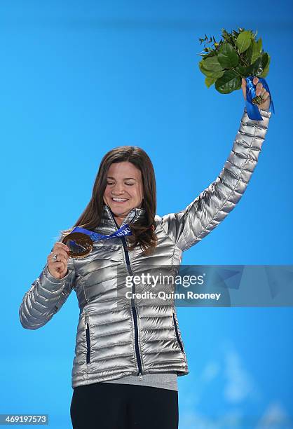 Bronze medalist Kelly Clark celebrates during the medal ceremony for the Snowboard Ladies' Halfpipe on day six of the Sochi 2014 Winter Olympics at...