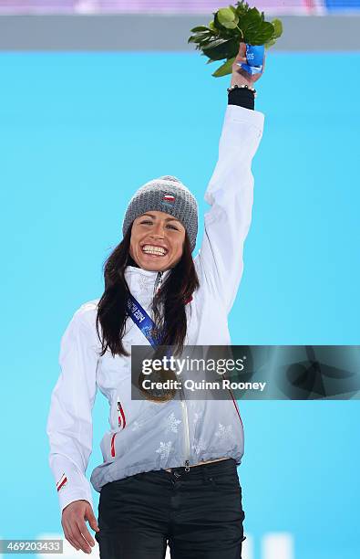 Gold medalist Justyna Kowalczyk of Poland celebrates during the medal ceremony for the Women's 10 km Classic on day six of the Sochi 2014 Winter...