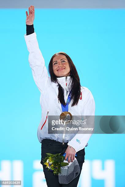 Gold medalist Justyna Kowalczyk of Poland celebrates during the medal ceremony for the Women's 10 km Classic on day six of the Sochi 2014 Winter...
