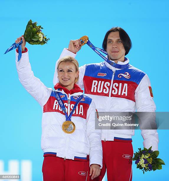 Gold medalists Tatiana Volosozhar and Maxim Trankov of Russia celebrate during the medal ceremony for the Figure Skating Pairs Free Skating on day...