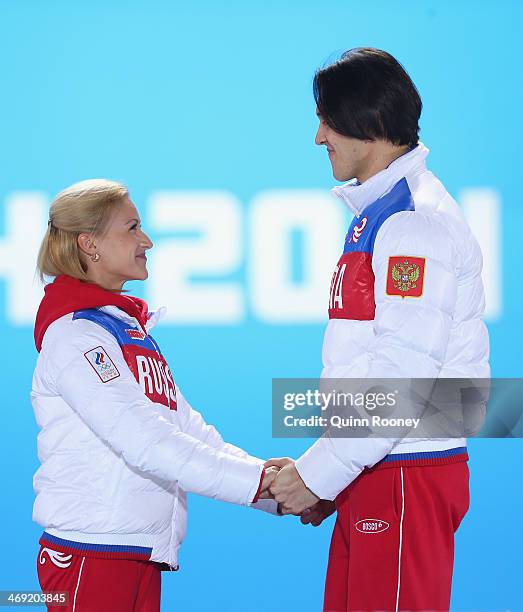 Gold medalists Tatiana Volosozhar and Maxim Trankov of Russia celebrate during the medal ceremony for the Figure Skating Pairs Free Skating on day...