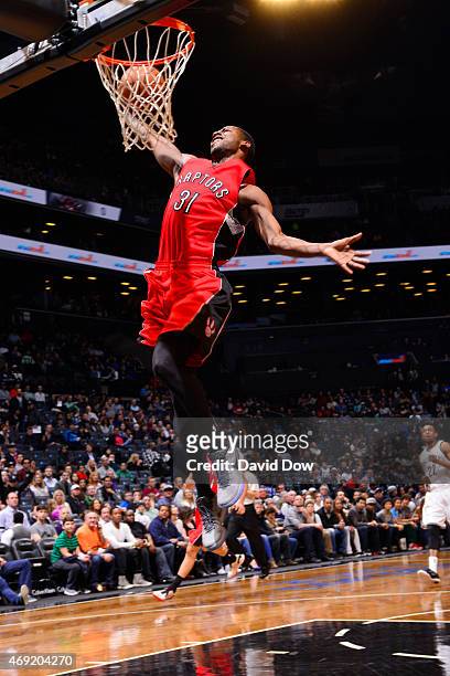 James Johnson of the Toronto Raptors dunks the ball against the Brooklyn Nets at Barclays Center on April 3, 2015 in Brooklyn, New York NOTE TO USER:...