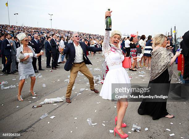 Racegoer celebrates as she attends day 2 'Ladies Day' of the Crabbie's Grand National Festival at Aintree Racecourse on April 10, 2015 in Liverpool,...