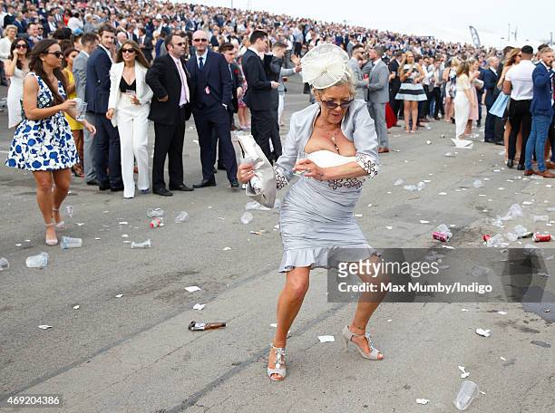 Racegoer attends day 2 'Ladies Day' of the Crabbie's Grand National Festival at Aintree Racecourse on April 10, 2015 in Liverpool, England.
