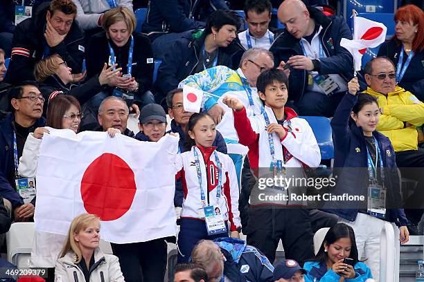 Narumi Takahashi , Ryuichi Kihara and Kanako Murakami and Japanese supporters cheer during the Men's Figure Skating Short Program on day 6 of the...