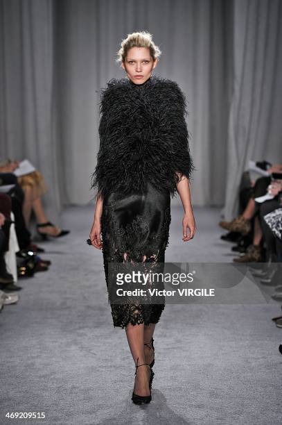 Model walks the runway during the Marchesa Ready to Wear Fall/Winter 2014-2015 show during Mercedes-Benz Fashion Week Fall 2014 on February 12, 2014...