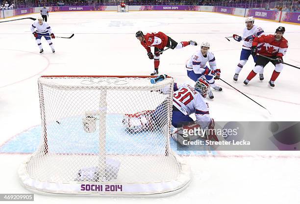 Jamie Benn of Canada scores a goal in the second period against Lars Haugen of Norway during the Men's Ice Hockey Preliminary Round Group B game on...