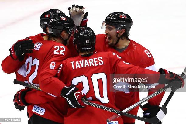 Jamie Benn of Canada celebrates with his teammates after scoring a goal in the second period against Lars Haugen of Norway during the Men's Ice...