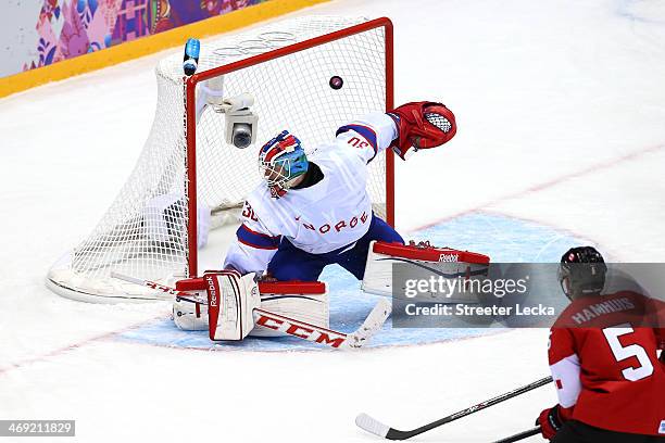 Jamie Benn of Canada scores a goal in the second period against Lars Haugen of Norway during the Men's Ice Hockey Preliminary Round Group B game on...