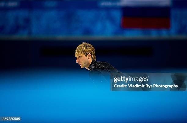 Evgeny Plyushchenko of Russia is seen at at a warm up during the Men's Figure Skating Short Program on day 6 of the Sochi 2014 Winter Olympics at the...