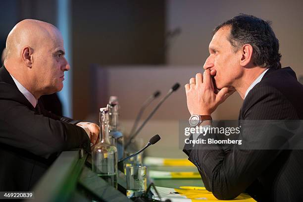 Giuseppe Recchi, chairman of Eni SpA, right, speaks with Claudio Descalzi, chief operating officer of Eni SpA, before a news conference following the...