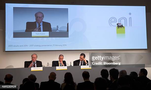 Paolo Scaroni, chief executive officer of Eni SpA, left, speaks as Roberto Albini, the company's press officer, center, and Giuseppe Recchi, chairman...