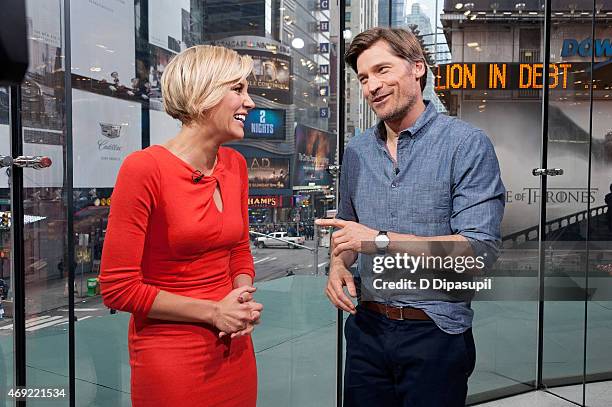 Charissa Thompson interviews Nikolaj Coster-Waldau during his visit to "Extra" at their New York Studios at H&M in Times Square on April 10, 2015 in...