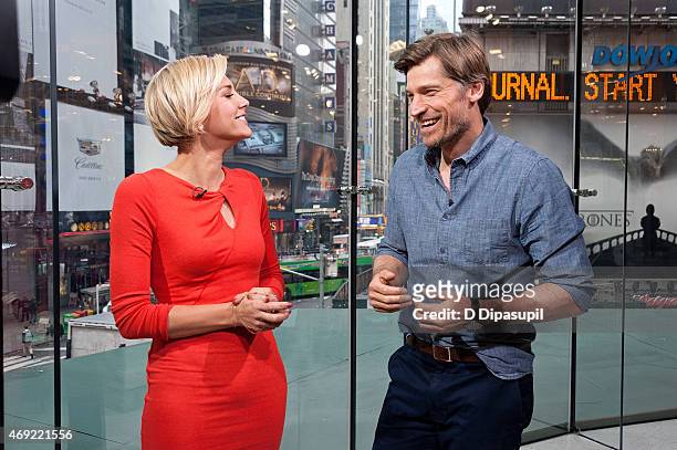 Charissa Thompson interviews Nikolaj Coster-Waldau during his visit to "Extra" at their New York Studios at H&M in Times Square on April 10, 2015 in...