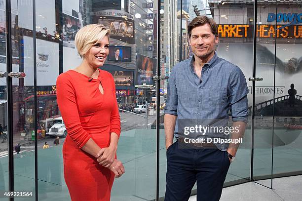 Charissa Thompson interviews Nikolaj Coster-Waldau during his visit to "Extra" at their New York Studios at H&M in Times Square on April 10, 2015 in...