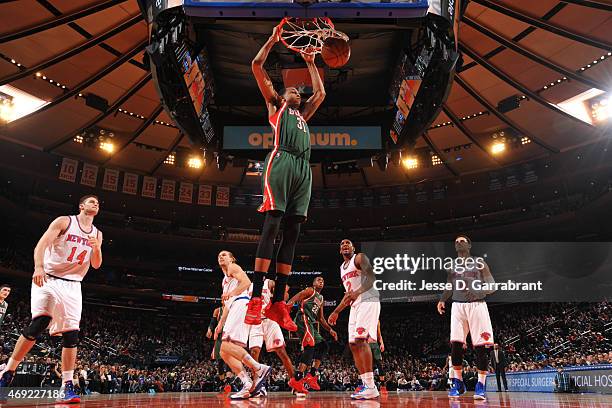 John Henson of the Milwaukee Bucks dunks the ball against the New York Knicks at Madison Square Garden on April 10, 2015 in New York, New York NOTE...