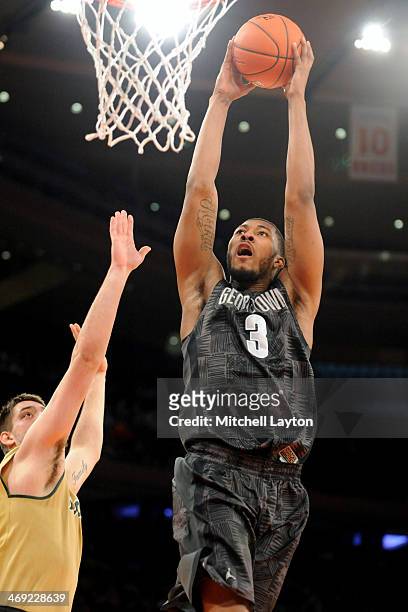 Mikael Hopkins of the Georgetown Hoyas cgoes for a jam during a college basketball game against the Michigan State Spartans on February 1, 2014 at...