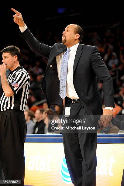 Assistant coach Tavaris Hardy of the Georgetwon Hoyas calls a play during a college basketball game against the Michigan State Spartans on February...