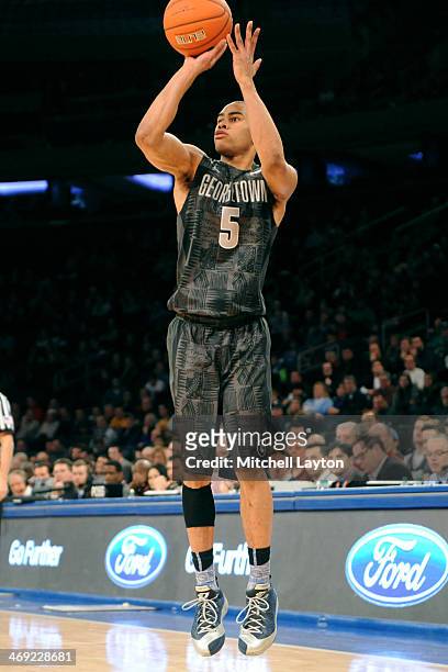 Markel Starks of the Georgetown Hoyas takes a jump shot during a college basketball game against the Michigan State Spartans on February 1, 2014 at...