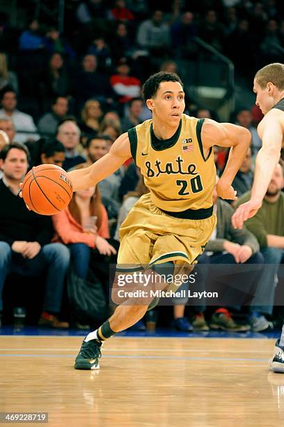 Travis Trice of the Michigan State Spartans dribbles to the basket during a college basketball game against the Georgetown Hoyas on February 1, 2014...