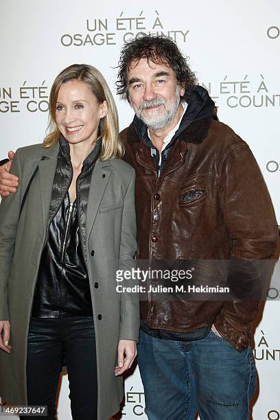 Emmanuel Chain and his wife Catherine attend the 'August : Osage County' Paris premiere at Cinema UGC Normandie on February 13, 2014 in Paris, France.
