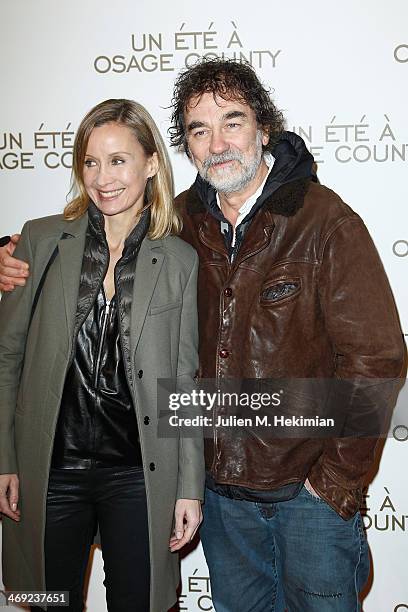 Emmanuel Chain and his wife Catherine attend the 'August : Osage County' Paris premiere at Cinema UGC Normandie on February 13, 2014 in Paris, France.