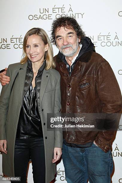 Olivier Marchal and his wife Catherine attend the 'August : Osage County' Paris premiere at Cinema UGC Normandie on February 13, 2014 in Paris,...