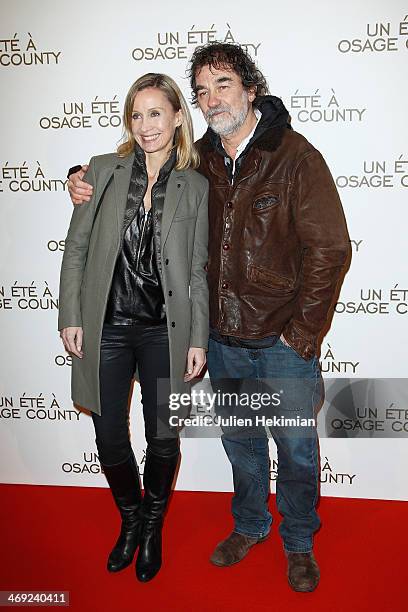 Olivier Marchal and his wife Catherine attend the 'August : Osage County' Paris premiere at Cinema UGC Normandie on February 13, 2014 in Paris,...