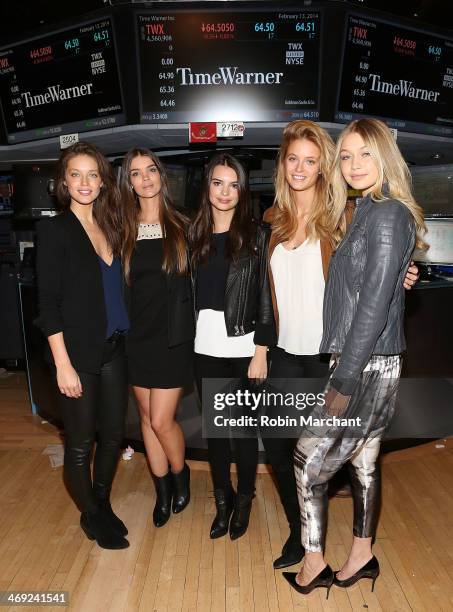 Models Natasha Barnard, Kate Bock, Emily DiDonato, Gigi Hadid and Emily Ratajkowski ring the closing bell at the New York Stock Exchange on February...