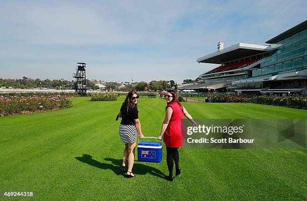 Racegoers arrive to attend Melbourne Racing at Flemington Racecourse on April 11, 2015 in Melbourne, Australia.