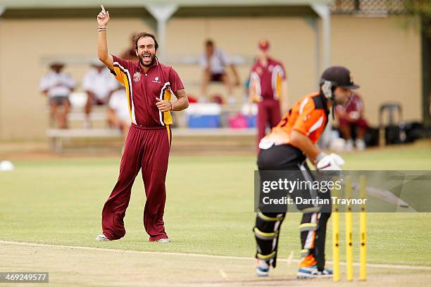 Preston White of Queensland celebrates taking a wicket during the Imparja Cup match between Queensland and the Northern Territory at Jim McConville...