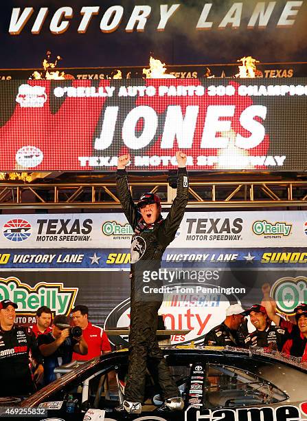 Erik Jones, driver of the GameStop/Mortal Kombat X Toyota, celebrates in victory lane after winning the NASCAR XFINITY Series O'Reilly Auto Parts 300...
