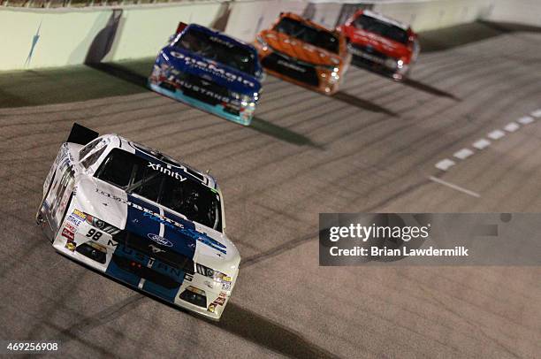 Sam Hornish, Jr., driver of the Carroll Shelby Engine Co. Ford, leads a pack of cars during the NASCAR XFINITY Series O'Reilly Auto Parts 300 at...