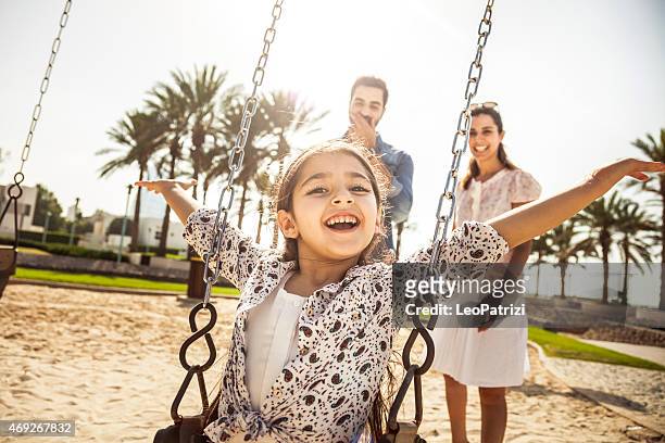 happy young family in dubai, uae - dubai family stock pictures, royalty-free photos & images