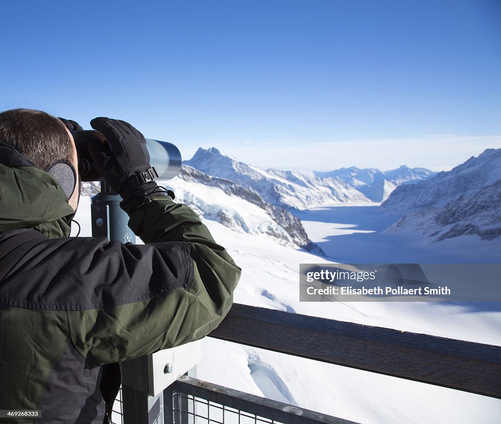 Man looking at view from Junfraujoch, Switzerland