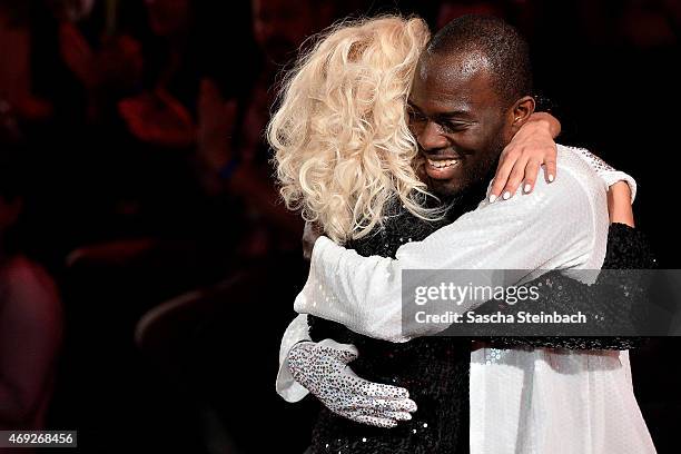 Hans Sarpei and Kathrin Menzinger react during the 4th show of the television competition 'Let's Dance' on April 10, 2015 in Cologne, Germany.