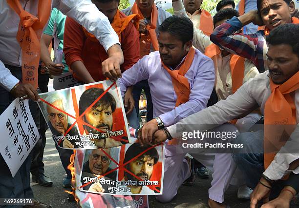 Hindu sena activist conducts protest & burn posters against J&K chief minister Mufti Mohammad Sayeed & the JKLF chairman Yasin Malik after their...