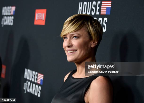 Actress Robin Wright arrives at the special screening of Netflix's "House of Cards" Season 2 at the Directors Guild Of America on February 13, 2014...