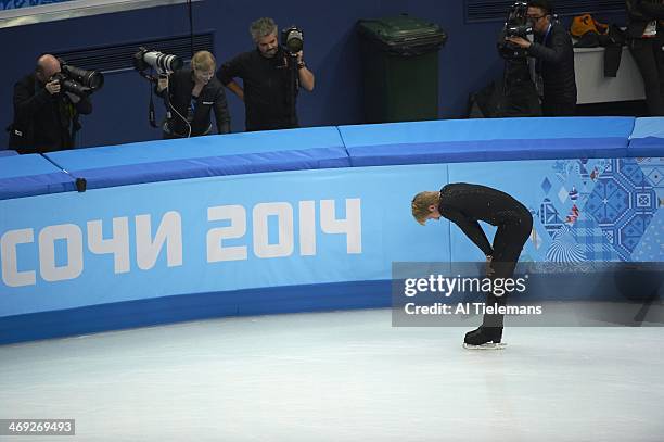 Winter Olympics: Russia Evgeny Plushenko sustaining injury during warmups before Men's Short Program at Iceberg Skating Palace. Sochi, Russia...