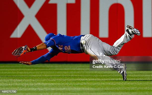 Juan Lagares of the New York Mets fails to catch this ball in the eighth inning that resulted in a double by Chris Johnson of the Atlanta Braves...