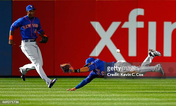 Juan Lagares of the New York Mets fails to catch this ball in the eighth inning that resulted in a double by Chris Johnson of the Atlanta Braves...