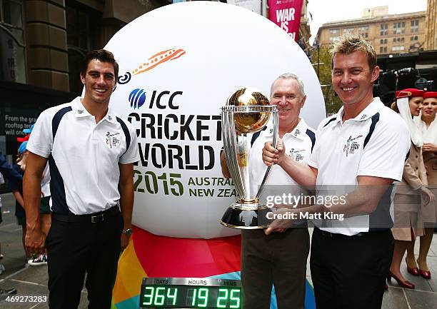 Australian cricketers Pat Cummins and Brett Lee and former Australian cricket captain Allan Border pose with the ICC Cricket World Cup during the...