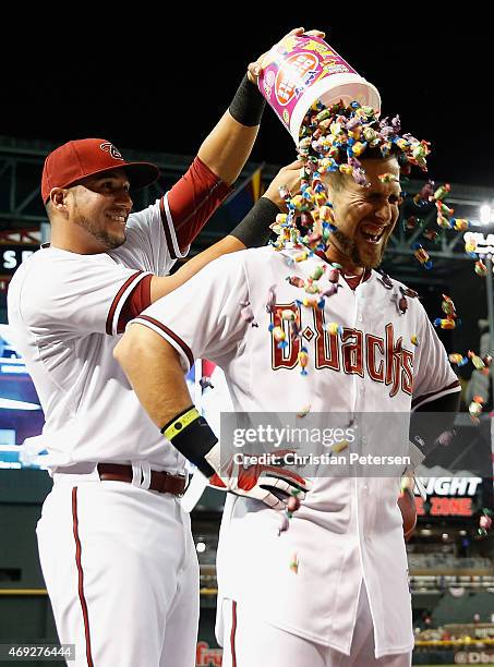 Ender Inciarte of the Arizona Diamondbacks is congratulated by David Peralta with a bubble gum dunk after Inciarte hit a walk off RBI single against...