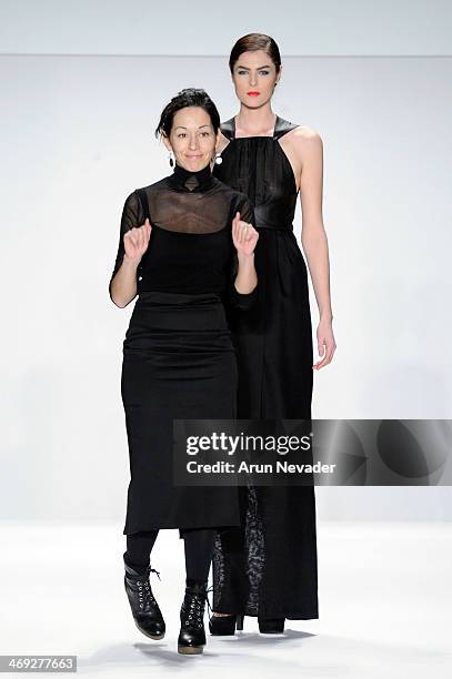 Designer Kokler and a model walk the runway wearing Kokler at the FLT Moda + Art Hearts Fashion show presented by AIDS Healthcare Foundation during...