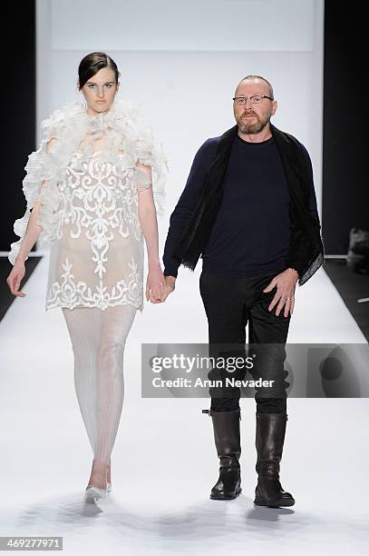 Designer Nino Lettieri and a model walk the runway at the FLT Moda + Art Hearts Fashion show presented by AIDS Healthcare Foundation during...