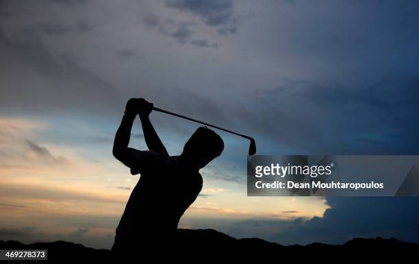 Robert Rock of England hits a practice shot on the driving range prior to Day 2 of the Africa Open at East London Golf Club on February 14, 2014 in...