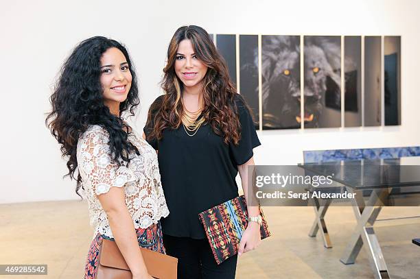 Diana Murcia and Michelle Rivera attend Andrew Levitas Metalwork Playground opening reception at Blueshift Wynwood on April 10, 2015 in Miami,...
