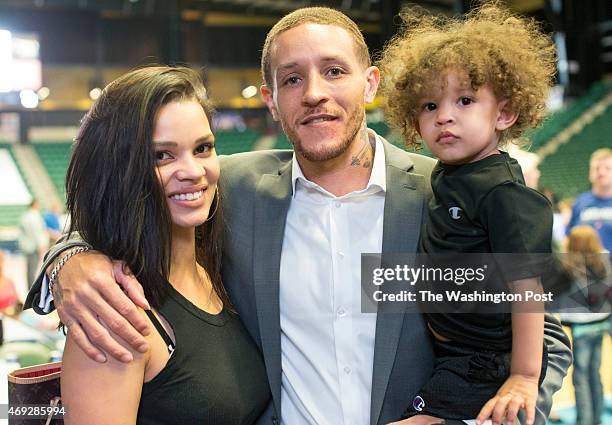 Texas Legends basketball player Delonte West with his wife Caressa and son Cash pose for a photo at the Dr. Pepper Arena on April 1, 2015 in Frisco,...